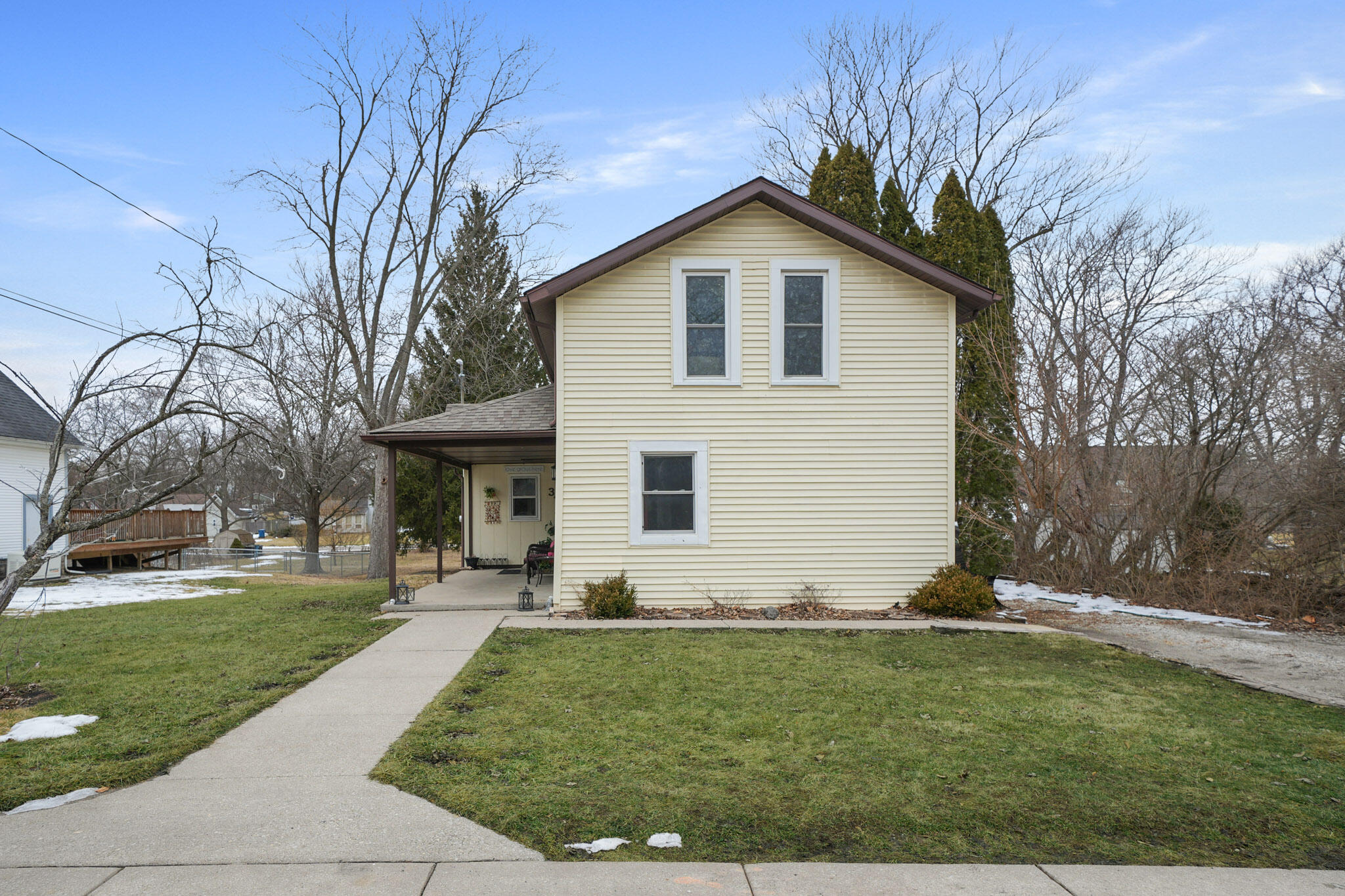 345 Castle Street Lowell, IN 46356 - Photo 6 of 27 a front view of a house with a yard