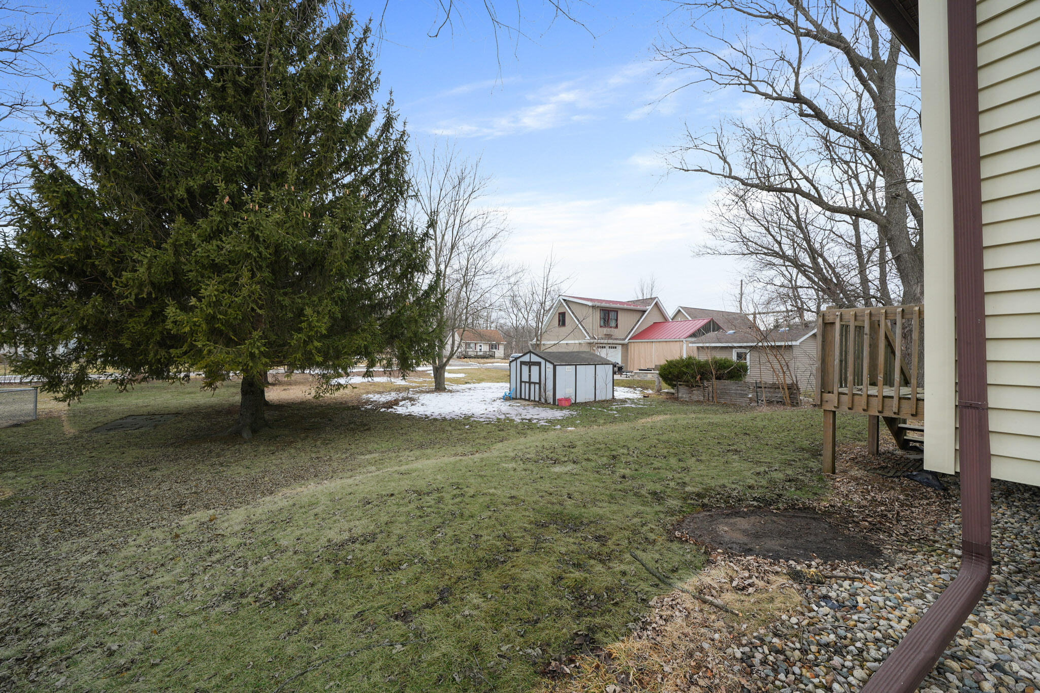 345 Castle Street Lowell, IN 46356 - Photo 10 of 27 a view of a tree in the middle of a yard