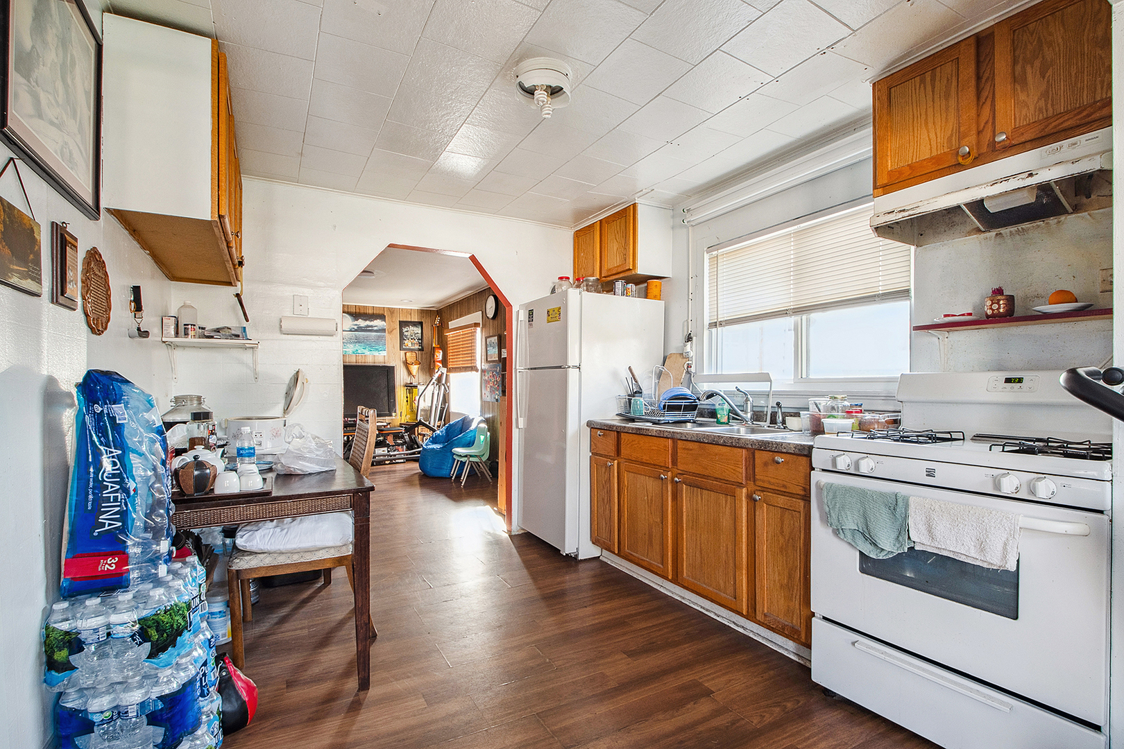 17073 Shea Avenue Hazel Crest, IL 60429 - Photo 15 of 27 a kitchen with granite countertop wooden floors and stainless steel appliances