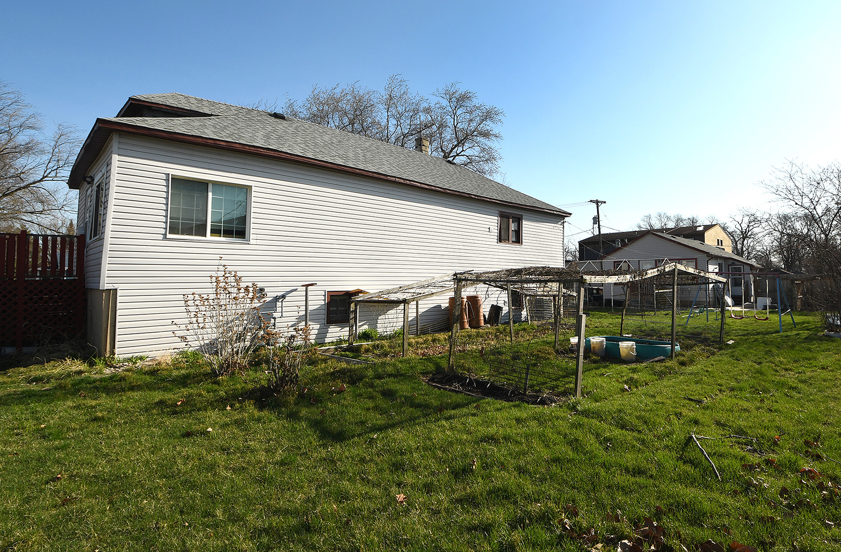 17073 Shea Avenue Hazel Crest, IL 60429 - Photo 21 of 27 a backyard of a house with plants and wooden fence