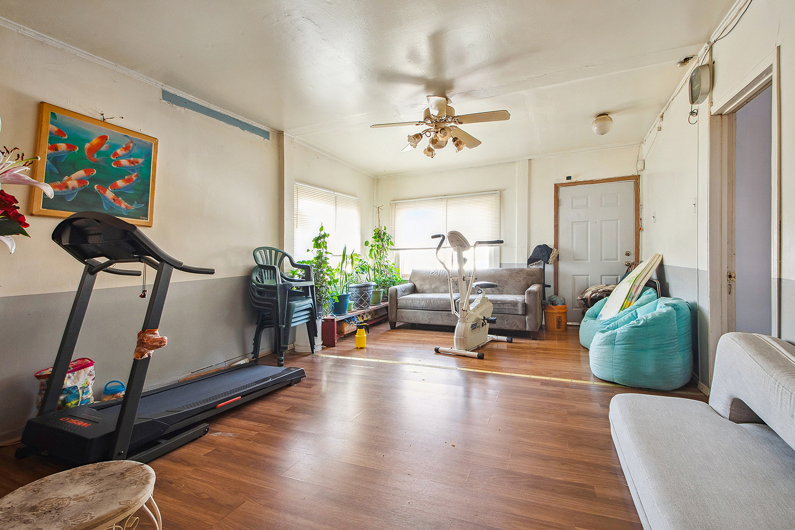 17073 Shea Avenue Hazel Crest, IL 60429 - Photo 3 of 27 a living room with furniture gym equipment and a flat screen tv