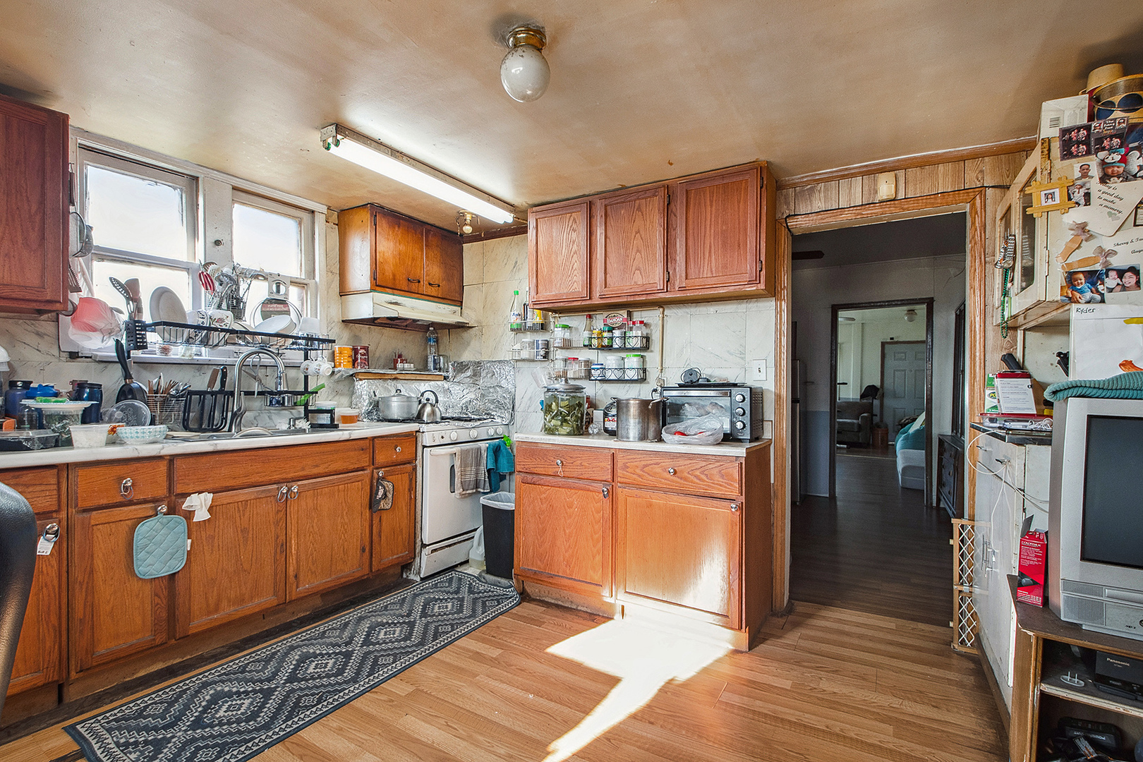 17073 Shea Avenue Hazel Crest, IL 60429 - Photo 6 of 27 a kitchen with stainless steel appliances granite countertop a refrigerator a stove and a sink with cabinets
