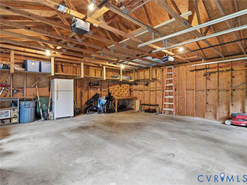 7707 Woodbrook Road Quinton, VA 23141 - Photo 35 of 42 Spacious garage featuring concrete flooring, expos