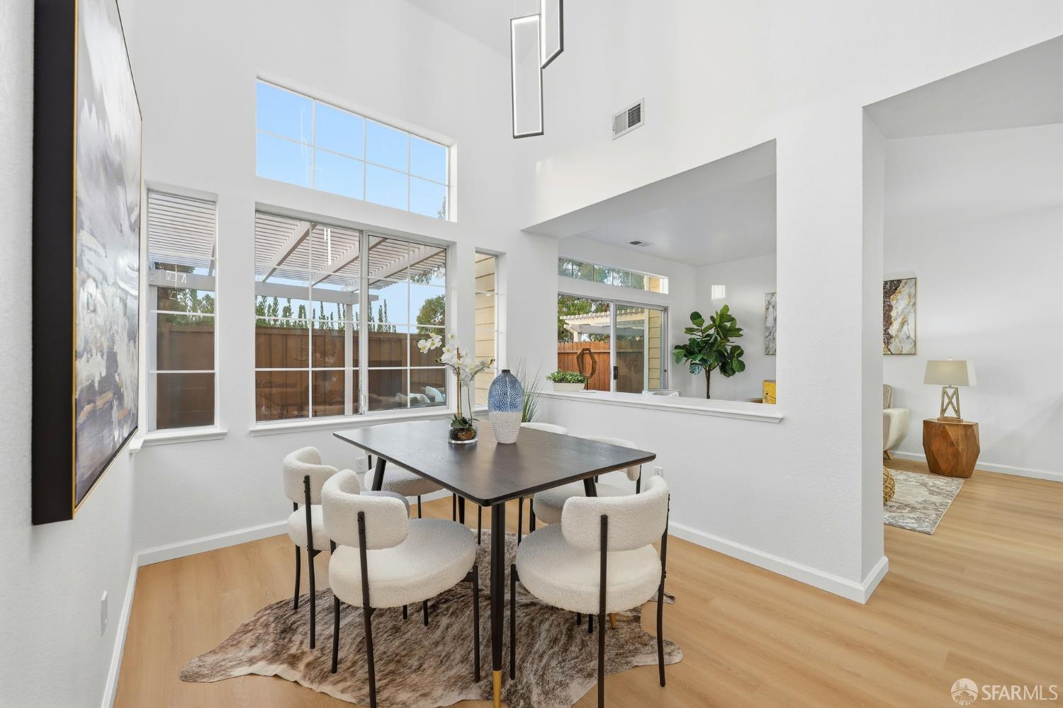 287 Scotts Valley Hercules, CA 94547 - Photo 16 of 42 a view of a dining room with furniture and wooden floor