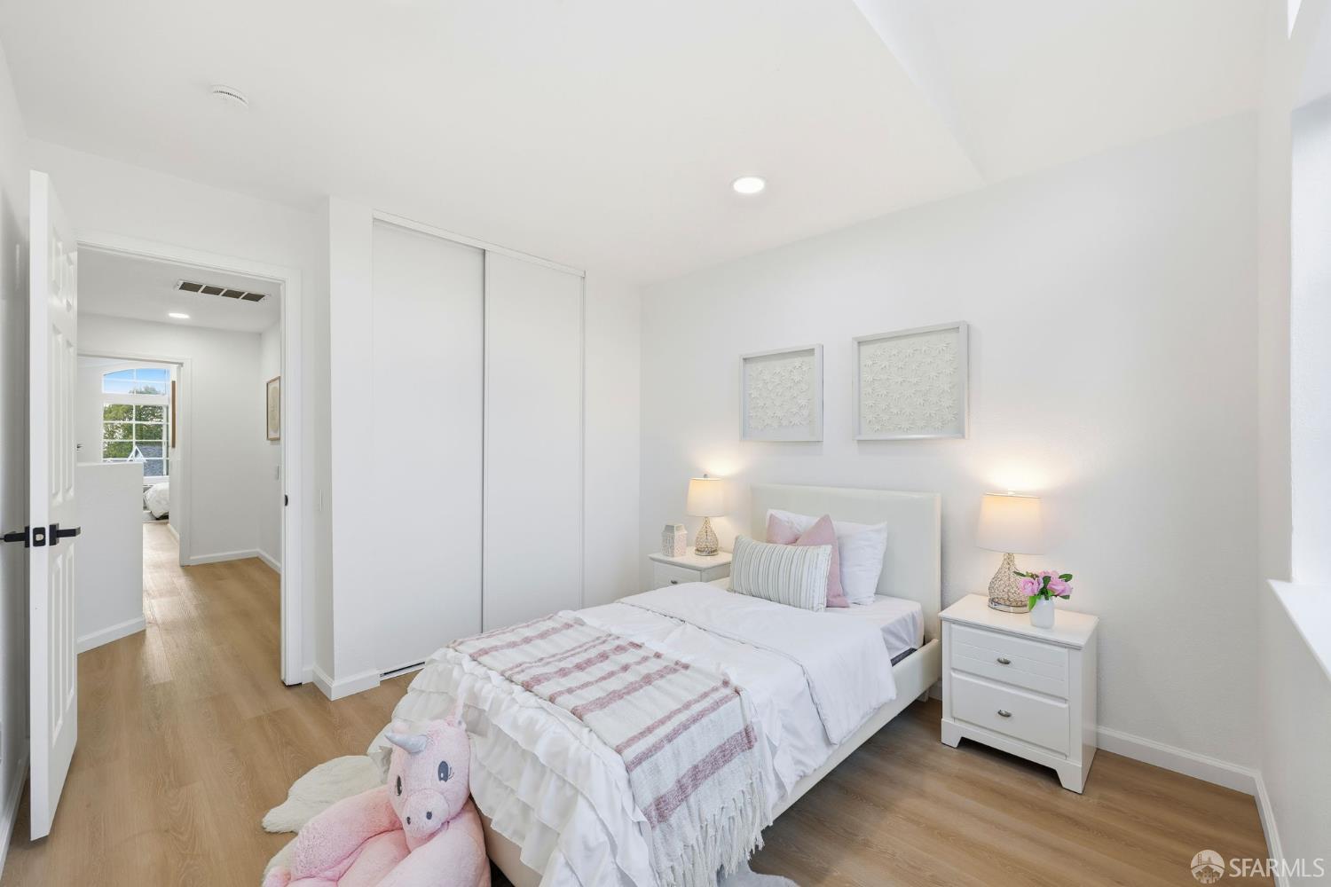 287 Scotts Valley Hercules, CA 94547 - Photo 25 of 42 a bedroom with a white bed and a cabinets