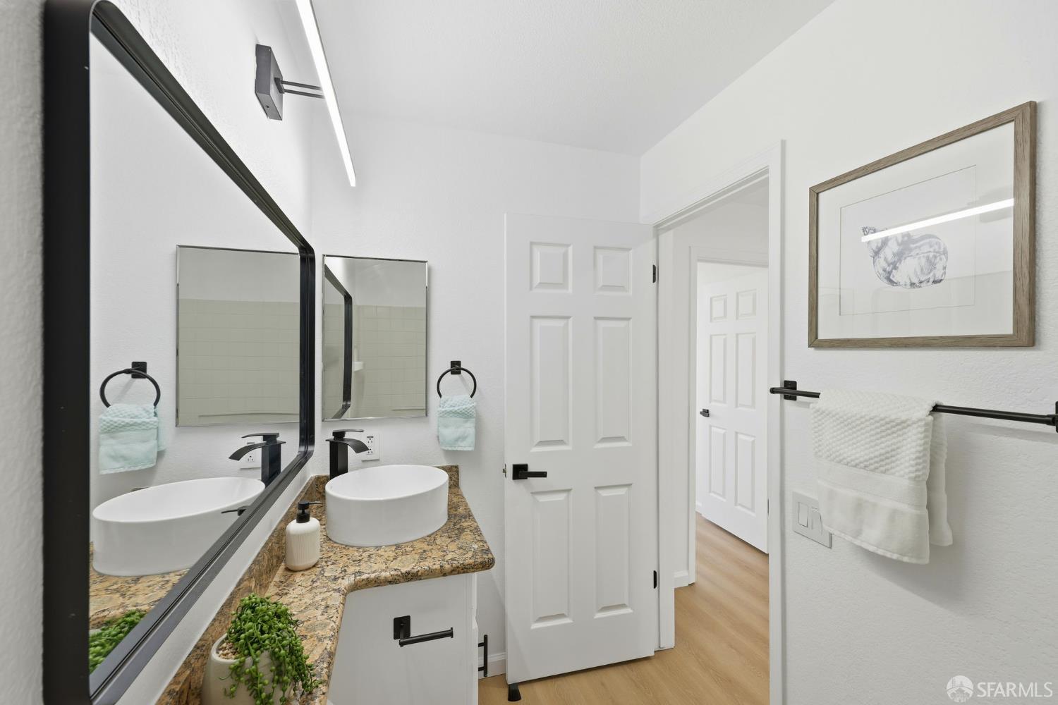 287 Scotts Valley Hercules, CA 94547 - Photo 31 of 42 a bathroom with a granite countertop tub sink and mirror