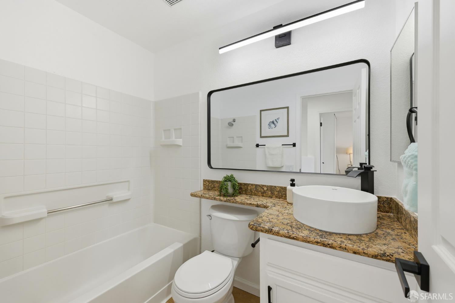 287 Scotts Valley Hercules, CA 94547 - Photo 32 of 42 a bathroom with a granite countertop sink mirror vanity and toilet