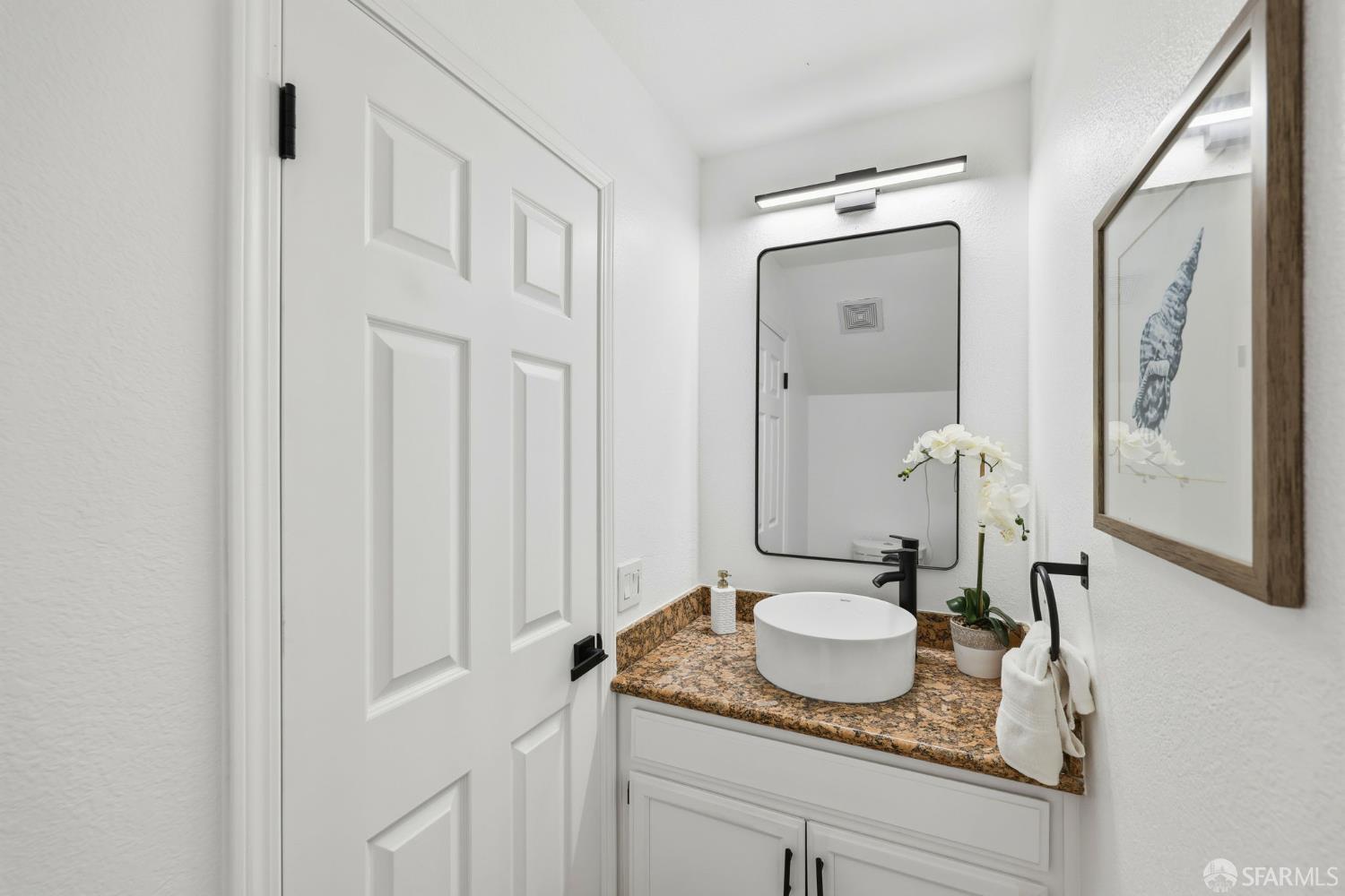 287 Scotts Valley Hercules, CA 94547 - Photo 34 of 42 a bathroom with a granite countertop sink and a mirror
