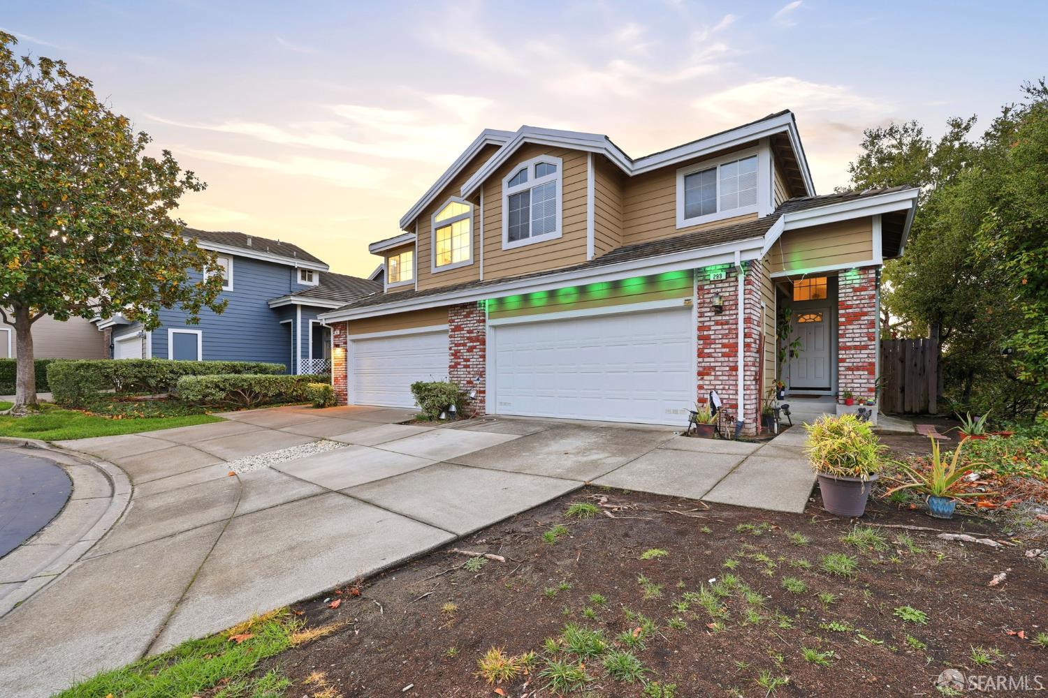 287 Scotts Valley Hercules, CA 94547 - Photo 5 of 42 a front view of a house with a yard and garage