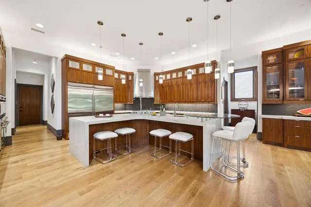 a room with lots of furniture and a wooden floor