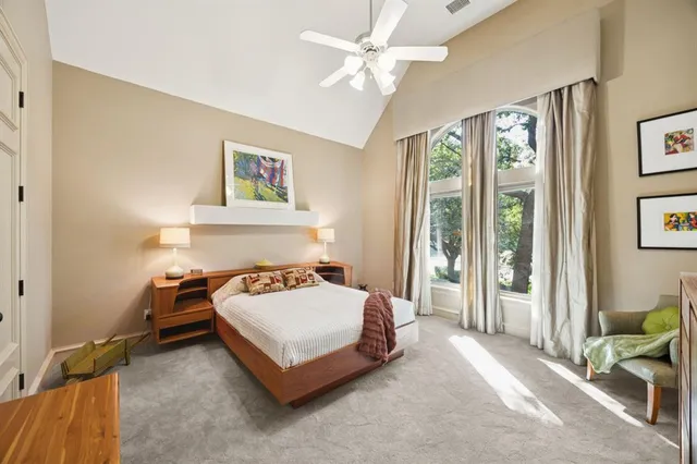 a bedroom with furniture and a chandelier