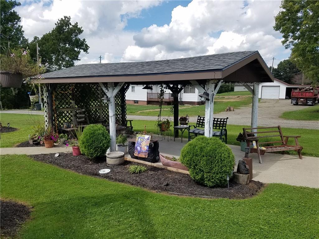 402 Levine Lane Ruffs Dale, PA 15679 - Photo 3 of 22 a view of a patio with a table chairs and a yard