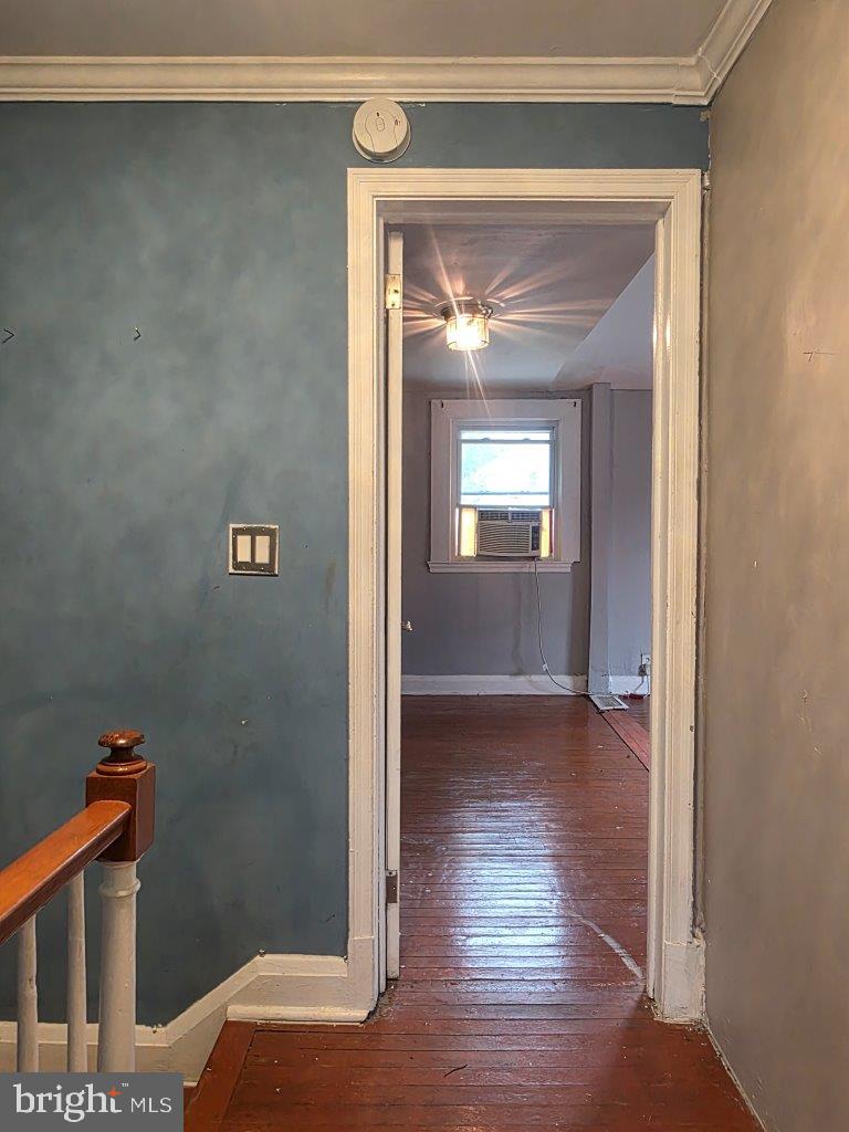 2211 Echodale Avenue Baltimore, MD 21214 - Photo 12 of 30 a view of a hallway view with wooden floor and staircase