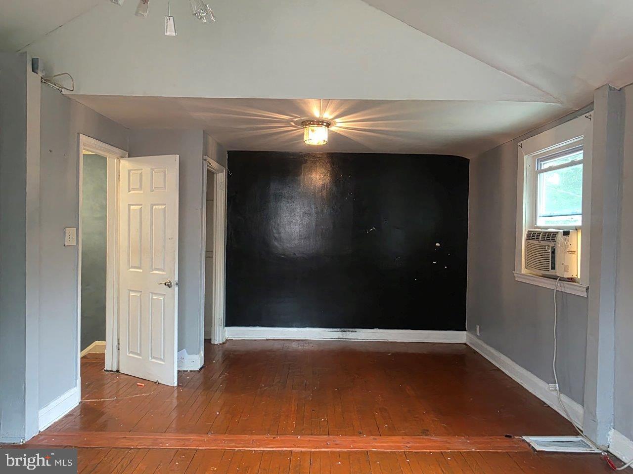 2211 Echodale Avenue Baltimore, MD 21214 - Photo 14 of 30 en empty room with wooden floor