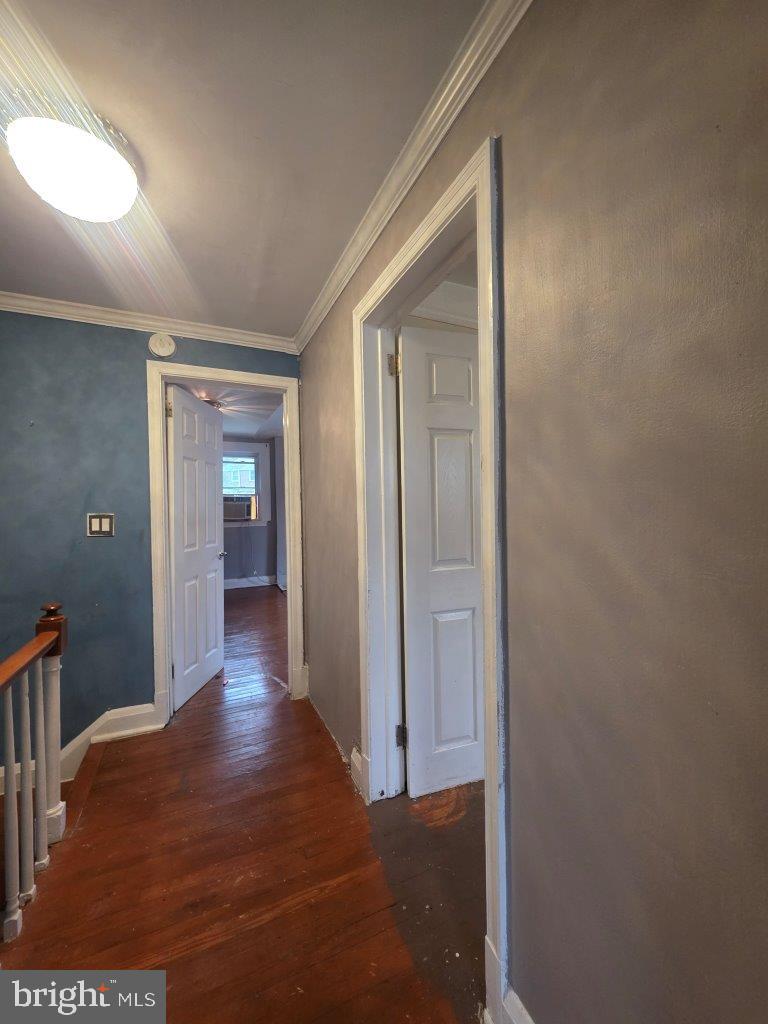 2211 Echodale Avenue Baltimore, MD 21214 - Photo 20 of 30 a view of a hallway with wooden floor and closet