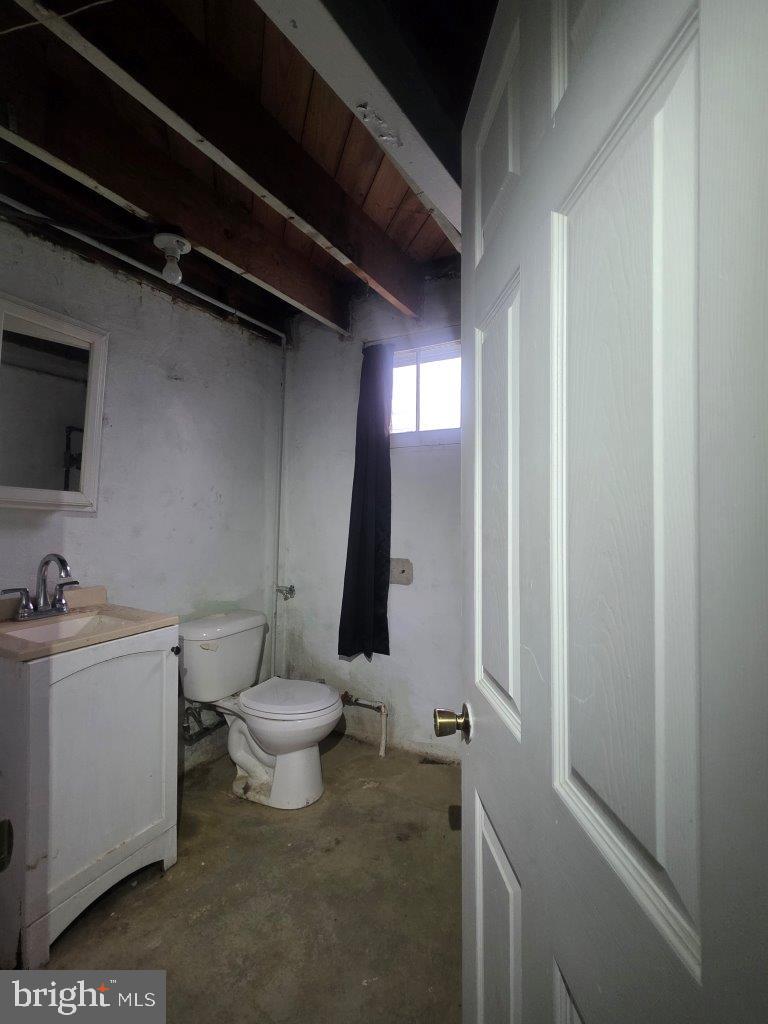 2211 Echodale Avenue Baltimore, MD 21214 - Photo 27 of 30 a bathroom with a sink a toilet and a mirror