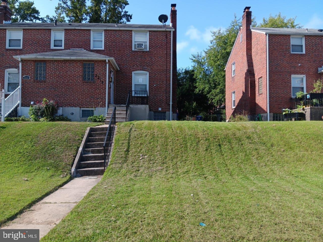 2211 Echodale Avenue Baltimore, MD 21214 - Photo 28 of 30 a front view of a house with a yard