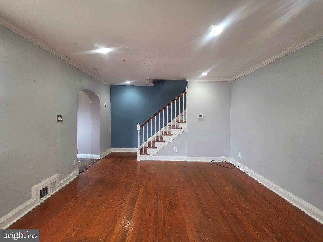 2211 Echodale Avenue Baltimore, MD 21214 - Photo 5 of 30 a view of a hallway with wooden floor