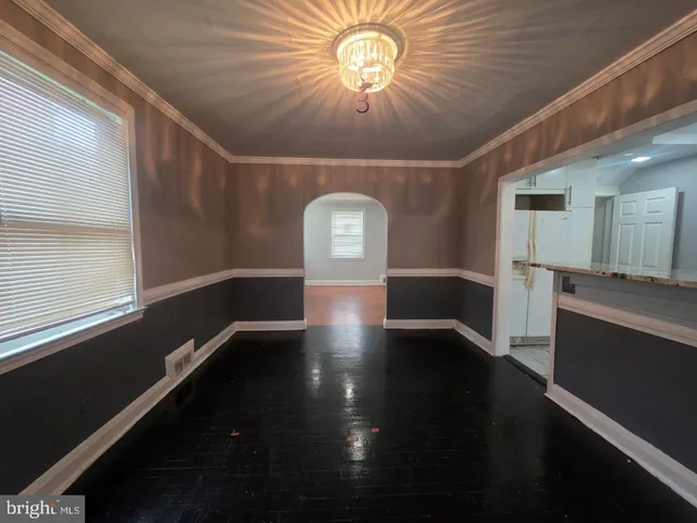 a kitchen with a sink window and cabinets