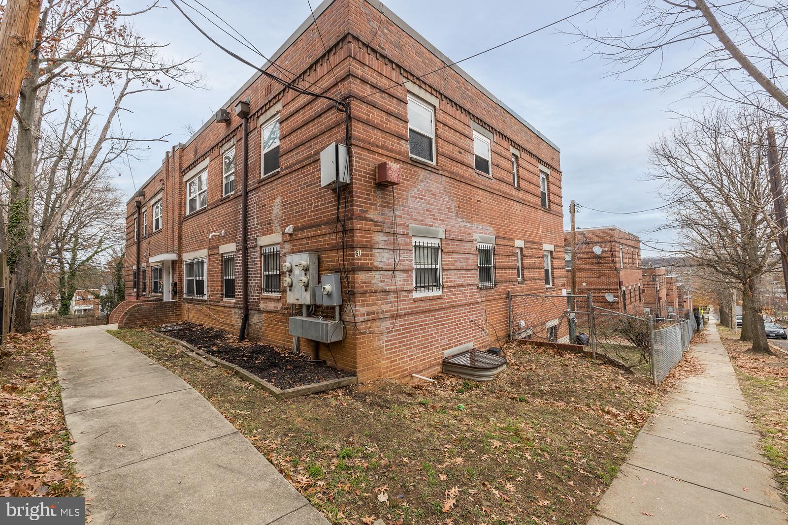 61 Forrester Street Southwest, Unit 104 Washington, DC 20032 - Photo 1 of 13 a front view of a building