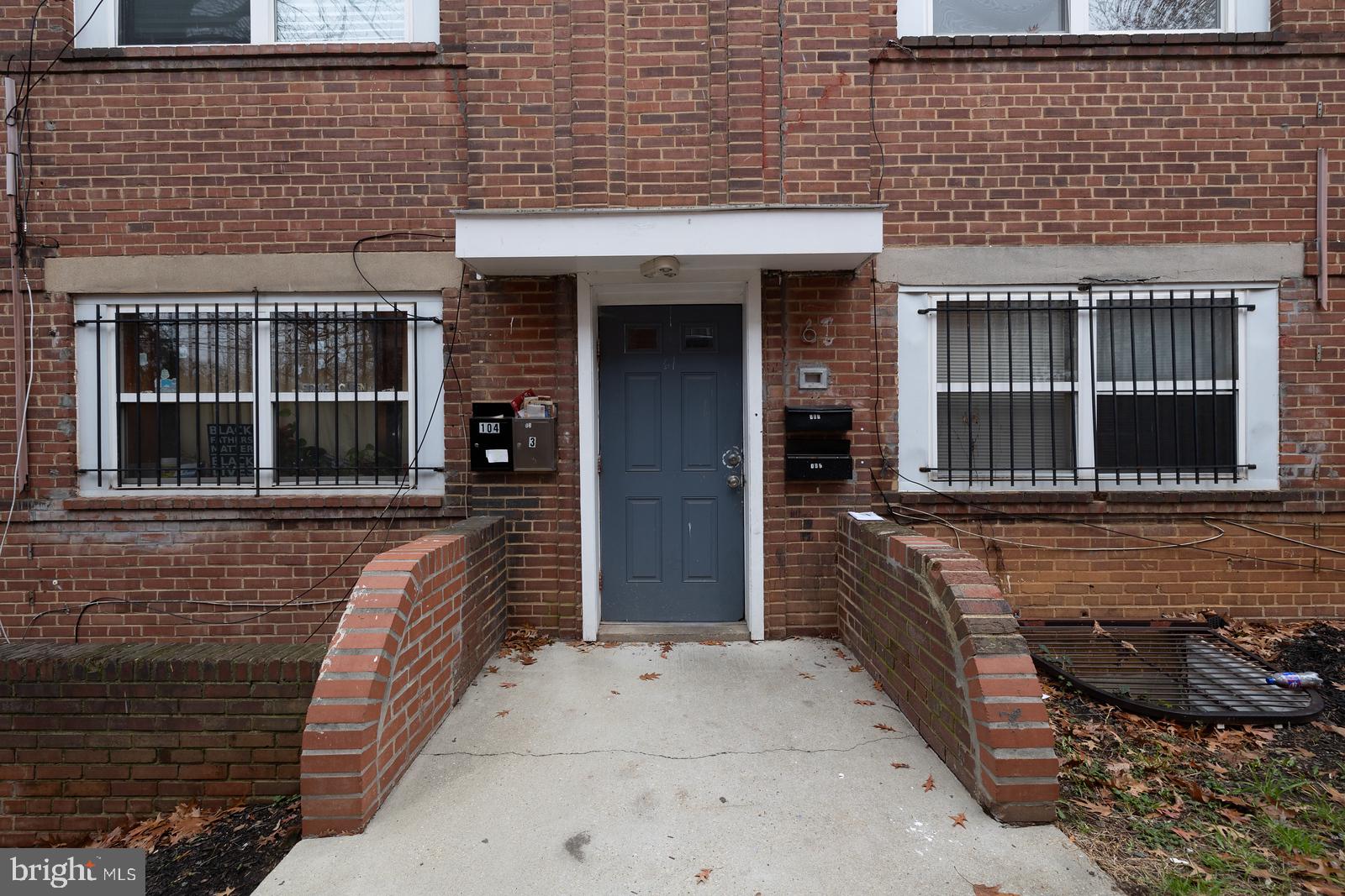 61 Forrester Street Southwest, Unit 104 Washington, DC 20032 - Photo 13 of 13 a front view of a house with a large window