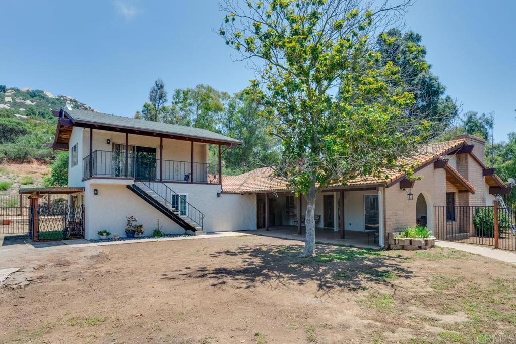 17620 Lyons Valley Road Jamul, CA 91935 - Photo 3 of 32 a front view of a house with a yard and garage