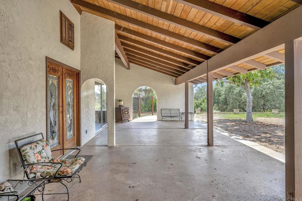 17620 Lyons Valley Road Jamul, CA 91935 - Photo 5 of 32 a view of a porch with chairs and backyard