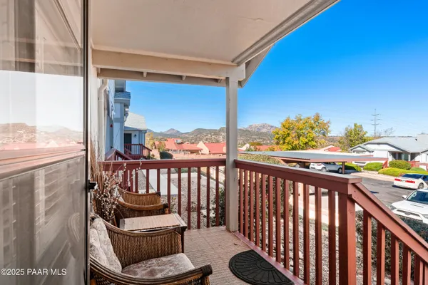 a view of balcony with furniture