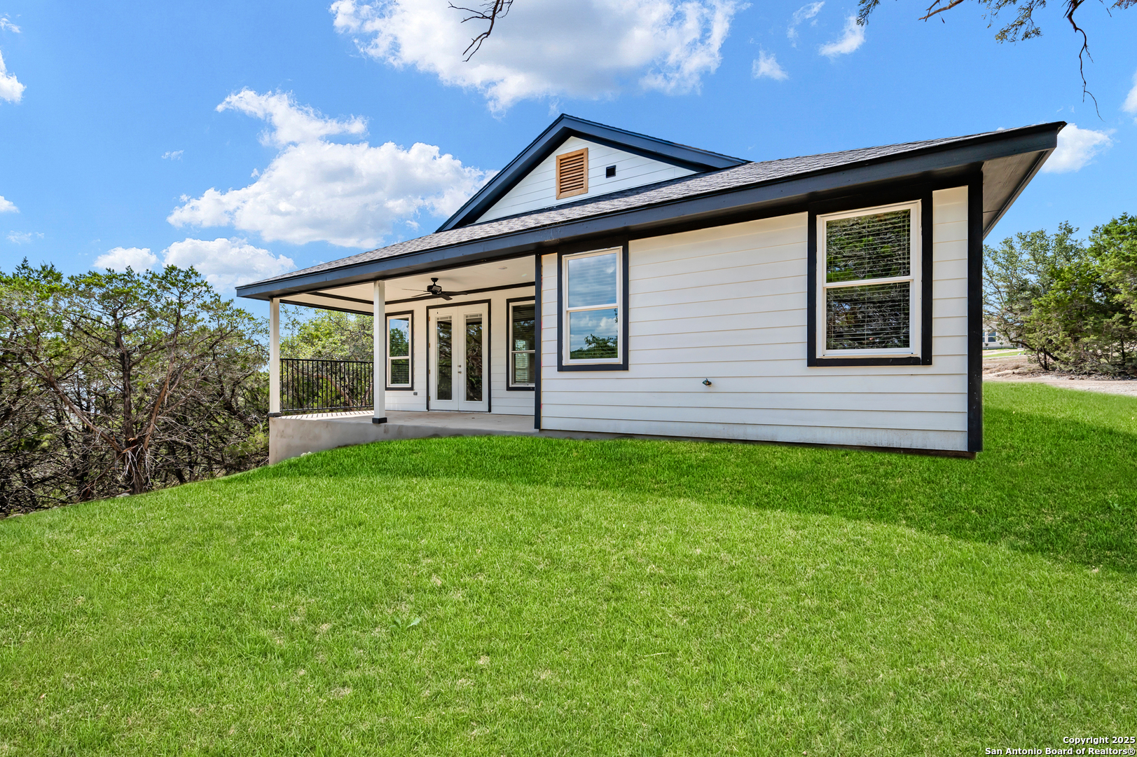 1066 Primrose Path Spring Branch, TX 78070 - Photo 18 of 24 a front view of a house with a garden