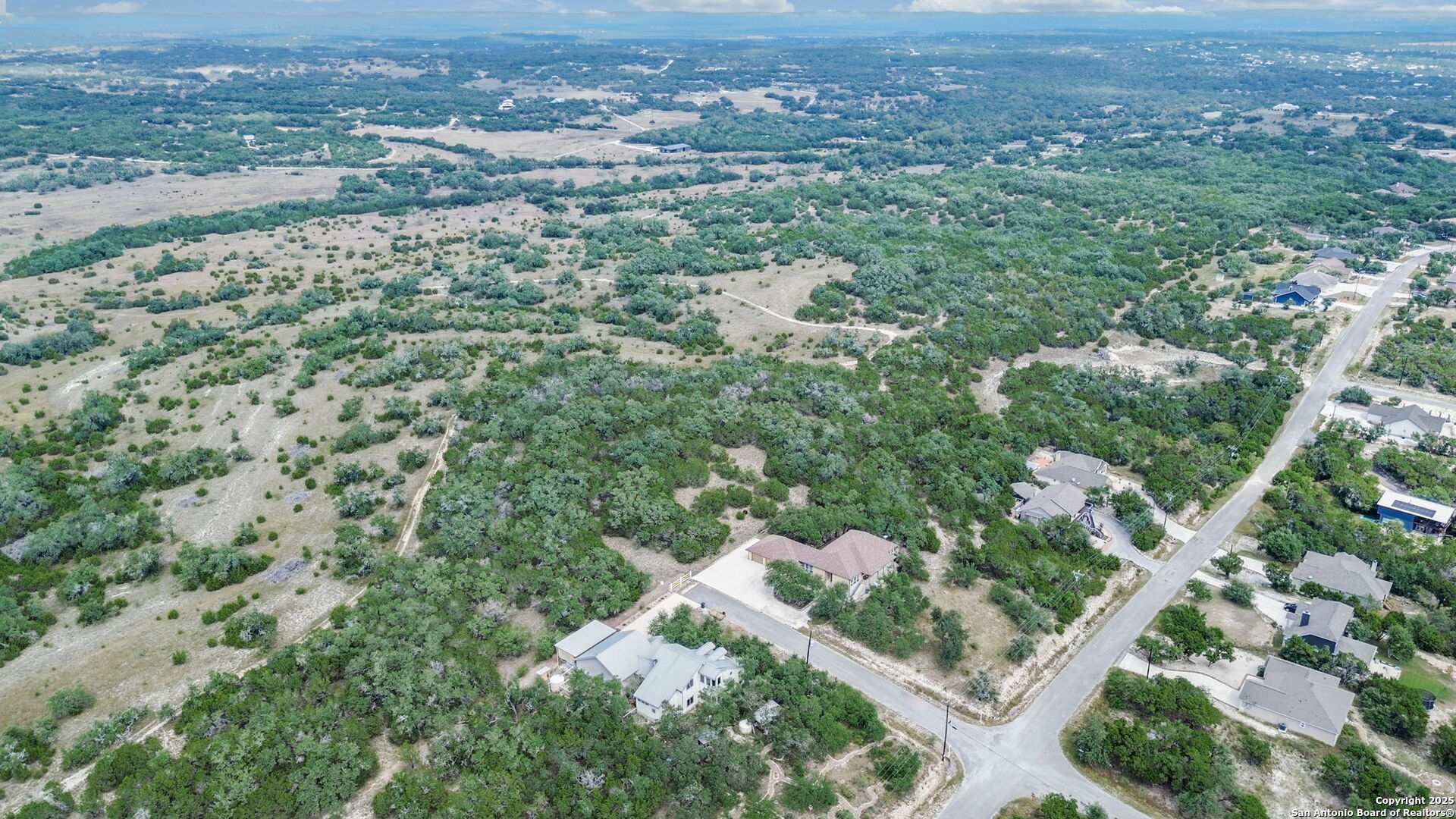 1066 Primrose Path Spring Branch, TX 78070 - Photo 23 of 24 an aerial view of residential houses with outdoor space and trees