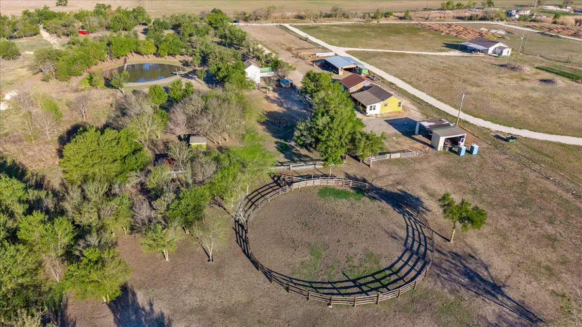 17309 Skog Road Elgin, TX 78621 - Photo 2 of 17 an aerial view of a house with outdoor space and lake view
