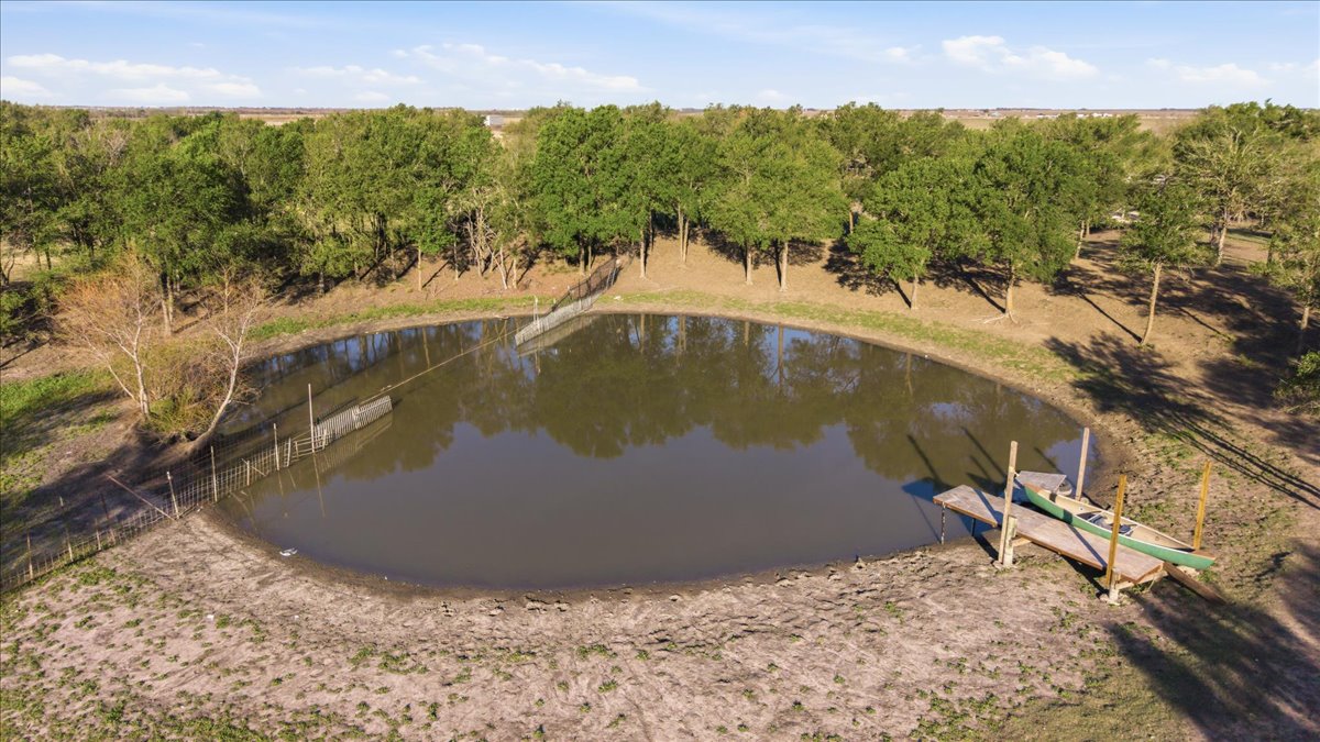 17309 Skog Road Elgin, TX 78621 - Photo 7 of 17 a view of a swimming pool with a yard