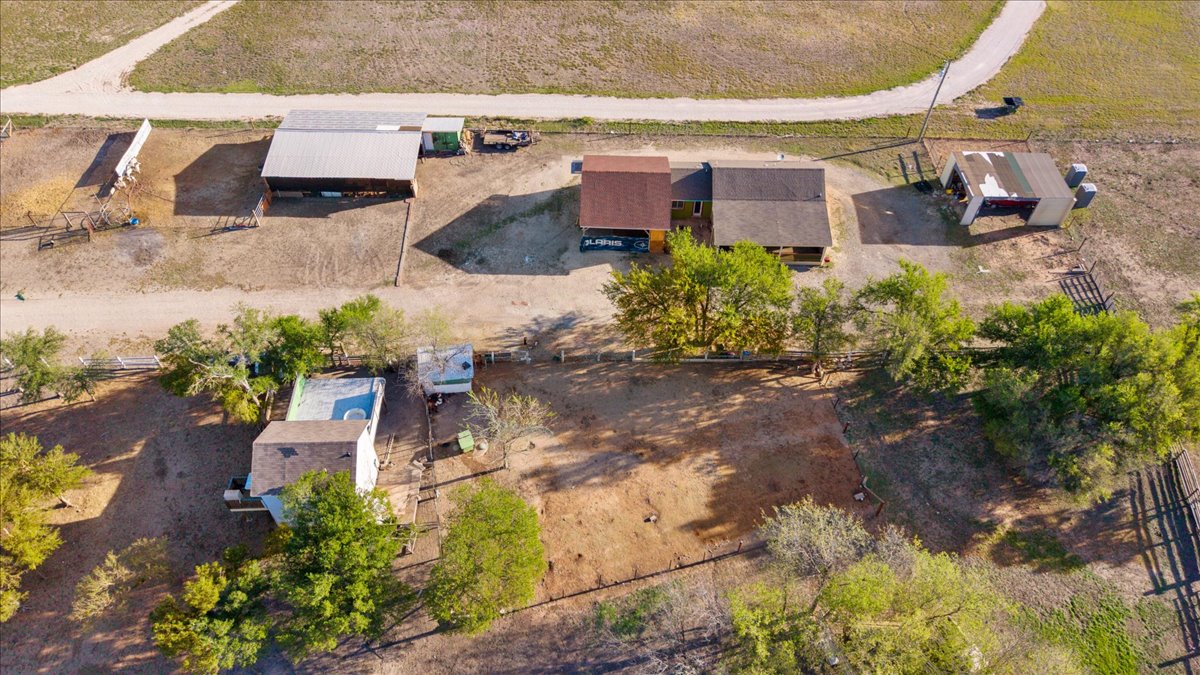 17309 Skog Road Elgin, TX 78621 - Photo 9 of 17 an aerial view of a house with a yard and a large tree
