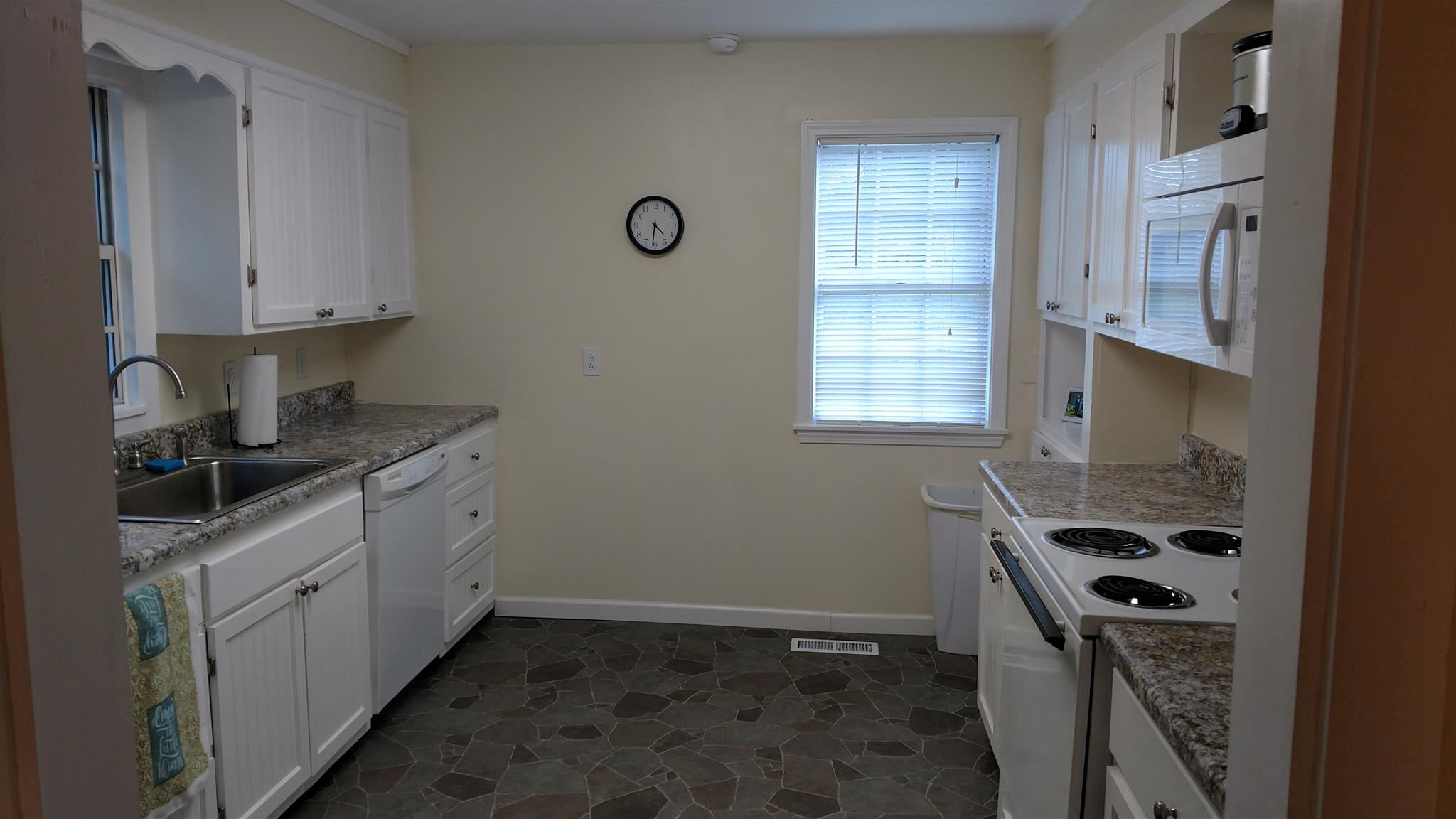 720 Butler Road Portland, TN 37148 - Photo 3 of 19 a kitchen with granite countertop a sink stove and cabinets
