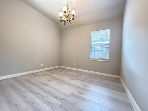a bathroom with a double vanity sink a toilet and a mirror