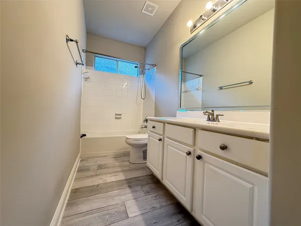 a view of a room with shelf on the wall