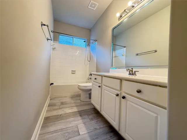 a view of a room with shelf on the wall