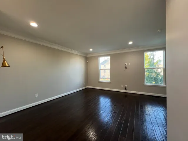 a view of an empty room and a window