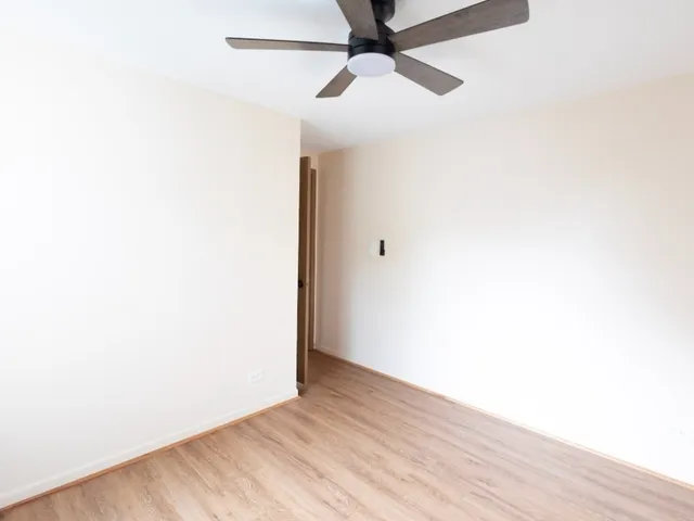 a view of a small space with wooden floor