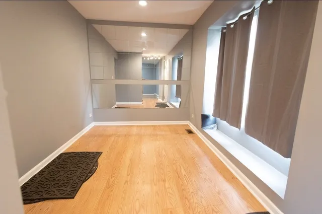 a bathroom with a tub and shower