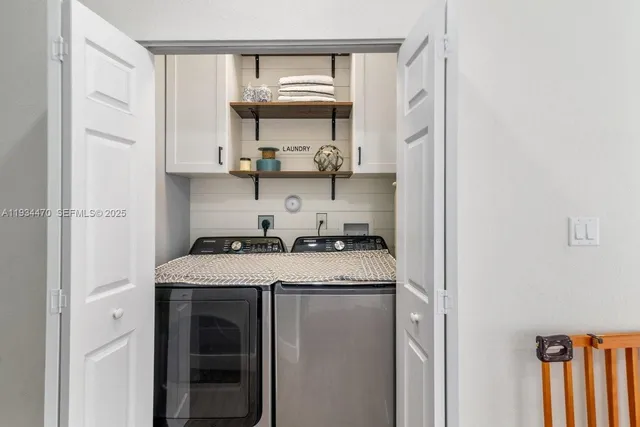 a kitchen with a sink a stove and cabinets