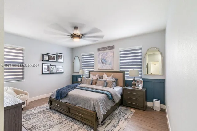 a bedroom with furniture a baby crib and a couch