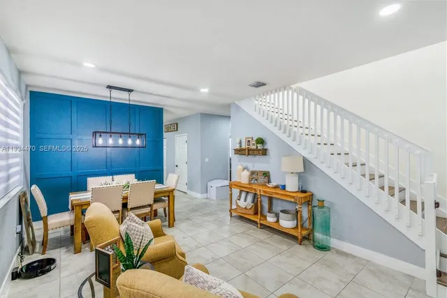 a room with furniture and stairs