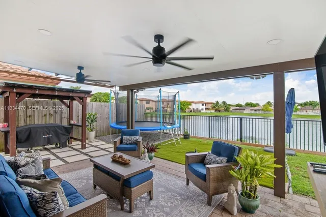 a living room with furniture fireplace and a flat screen tv