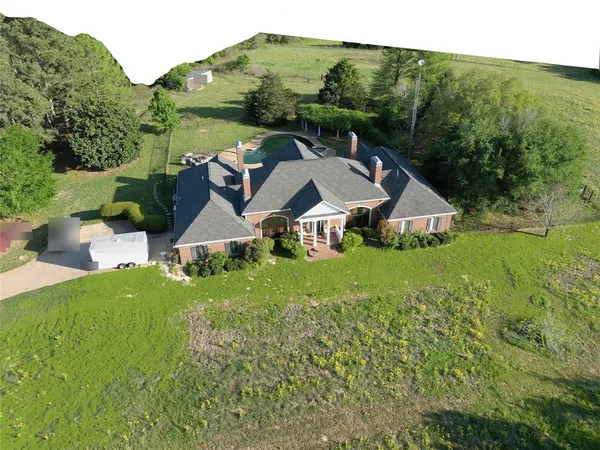 an aerial view of a house with garden