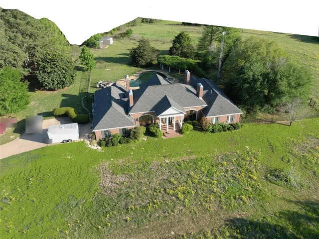 an aerial view of a house with garden