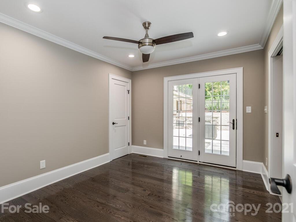 5923 Sharon View Road Charlotte, NC 28226 - Photo 12 of 44 a view of empty room with wooden floor and fan