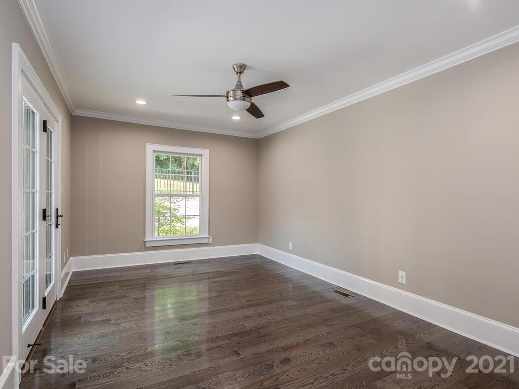 5923 Sharon View Road Charlotte, NC 28226 - Photo 15 of 44 wooden floor in an empty room with a window