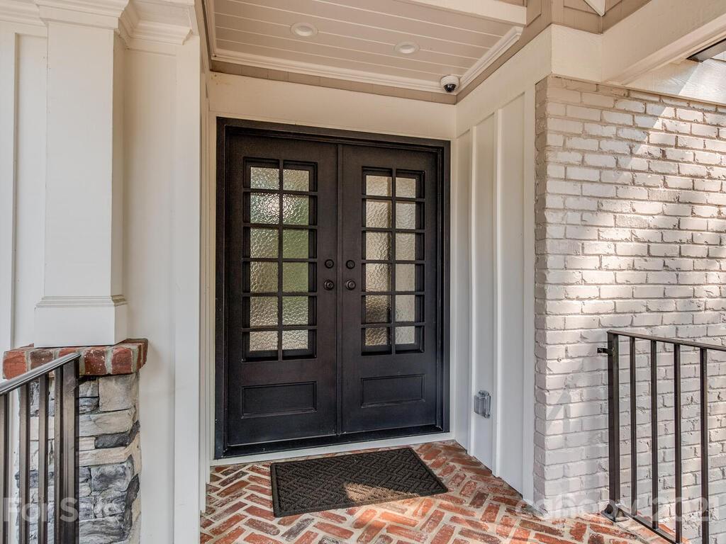 5923 Sharon View Road Charlotte, NC 28226 - Photo 2 of 44 a bedroom with a bed and a window