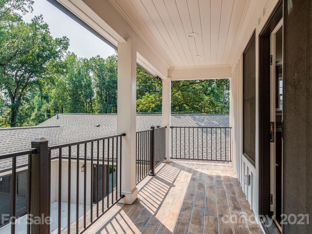 5923 Sharon View Road Charlotte, NC 28226 - Photo 32 of 44 a view of a balcony with wooden floor